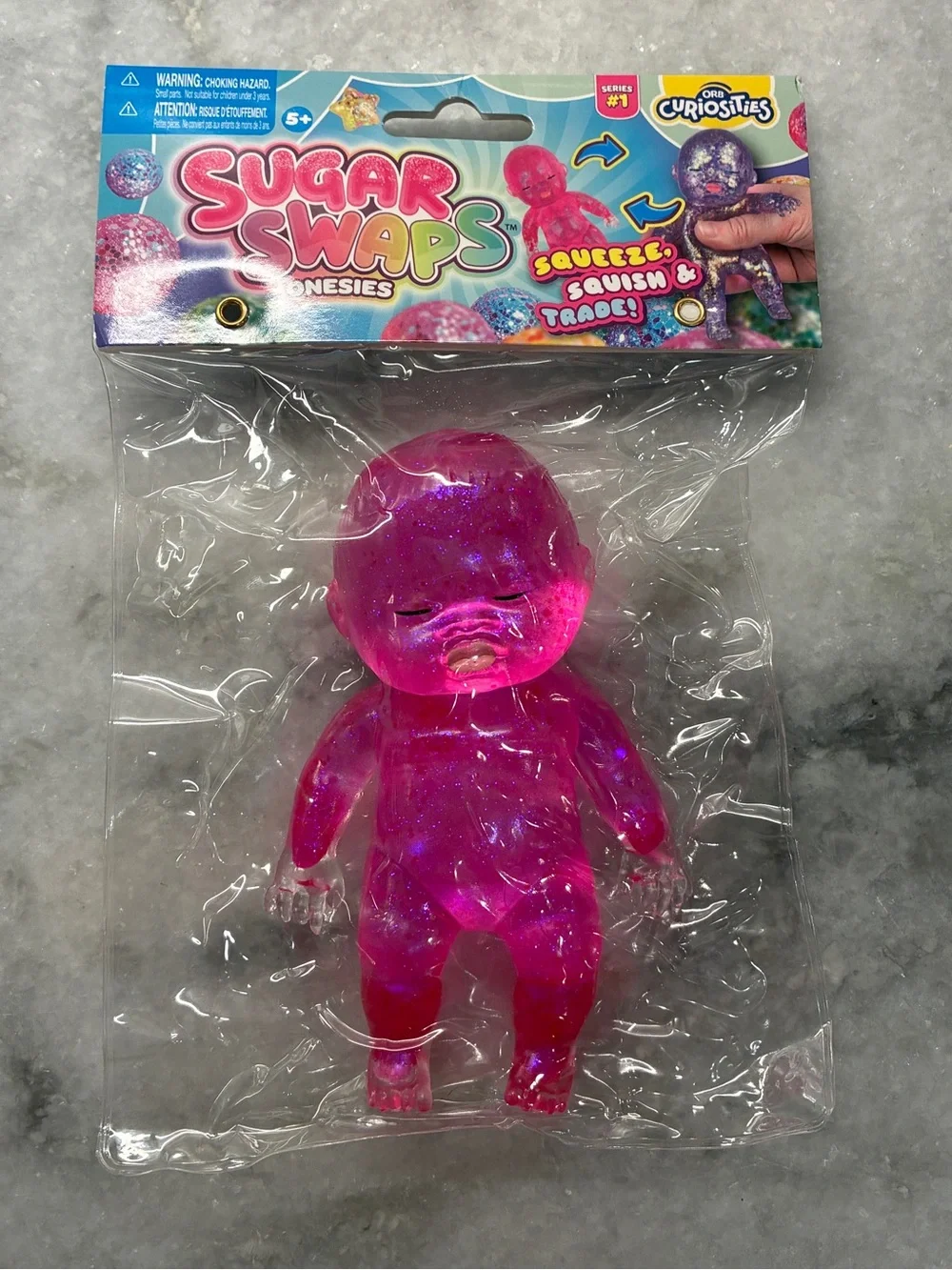 ✨ ORB Sugar Swaps Onesies Series 1 Pink Glitter Squishy Baby Fidget Toy ✨